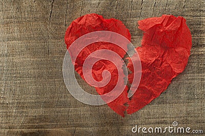 Heartbreak made â€‹â€‹of curled red paper Stock Photo